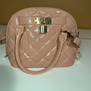 ALDO pink handbag with gold detail.
